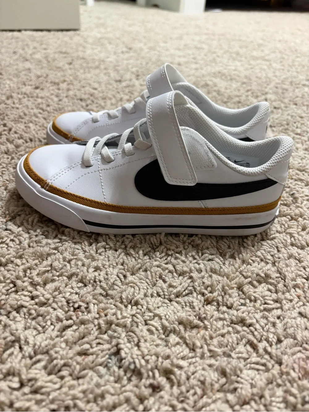 Nike White Sneakers with Black Swoosh and Gold Accent girls size 13 never worn